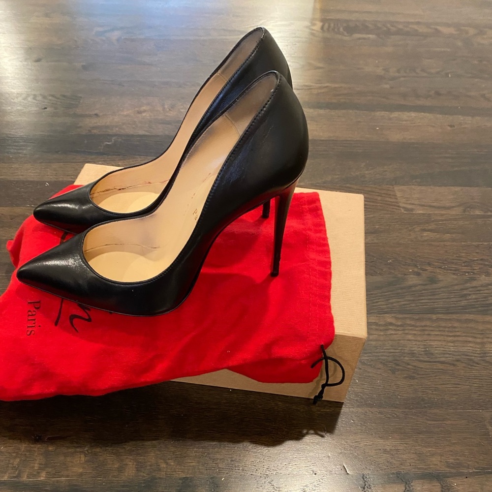 Black Louboutin heels